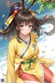 A woman in a yellow kimono sitting on the ground.